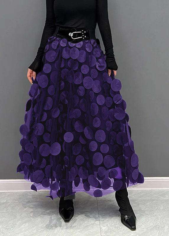 Graceful flowy A-line midi skirt with an elegant polka dot pattern, perfect for movement.