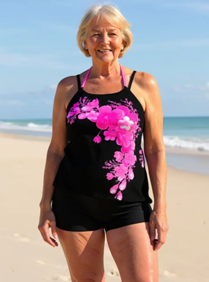 Fashionable women's floral tankini set, halter top & cross-strap detail. Perfect summer vacation swimwear.