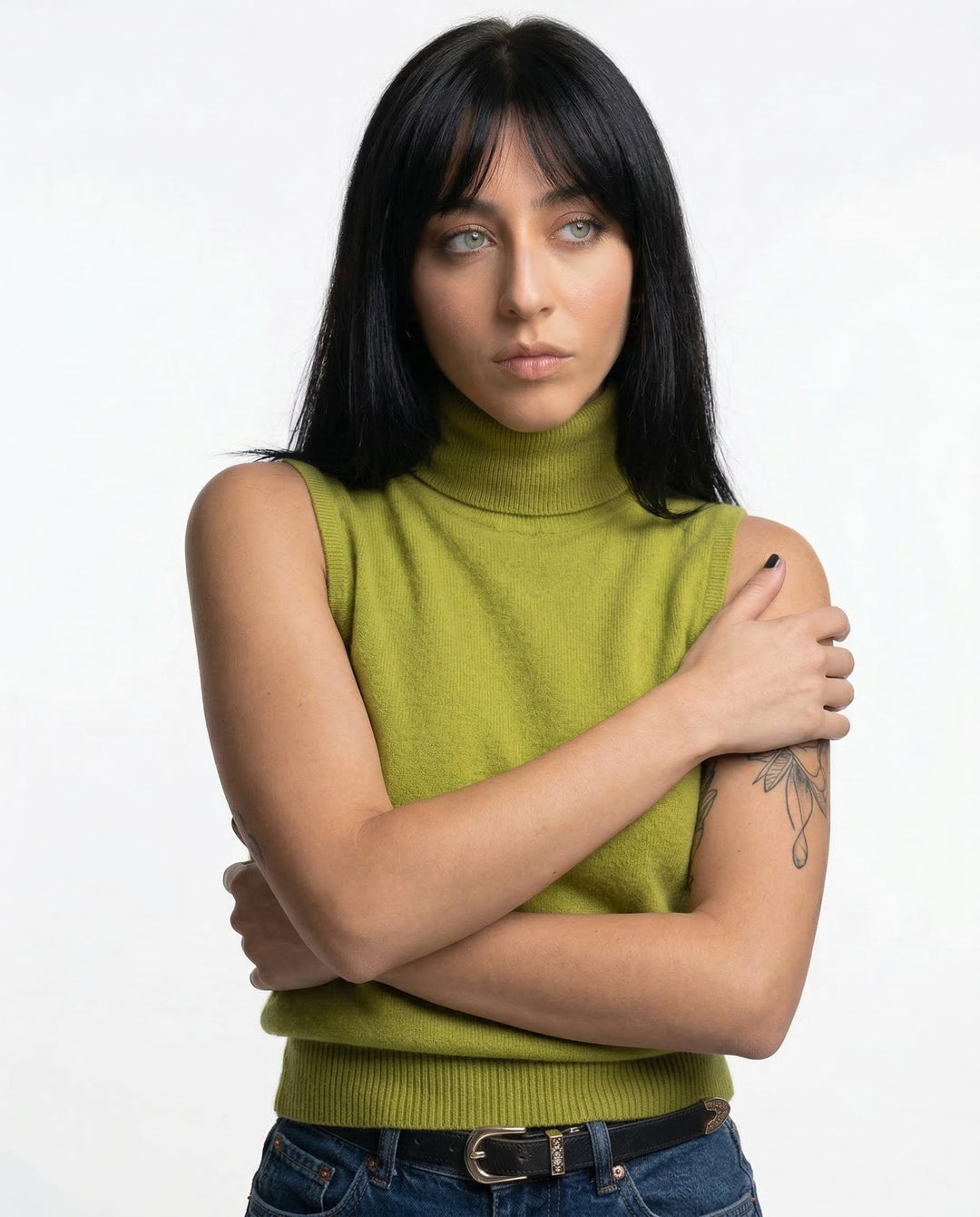 Comfortable women's turtleneck tank top, a versatile layering piece for transitional outfits.