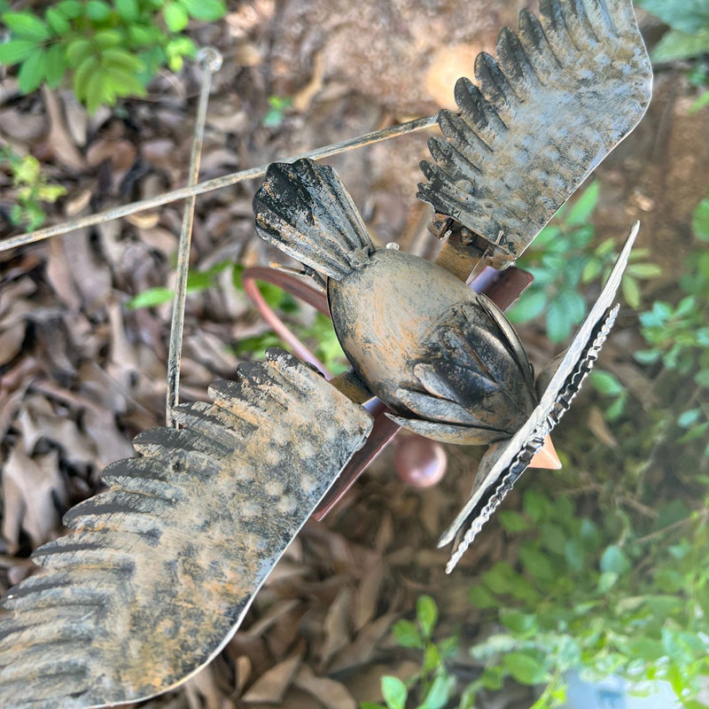 Kinetic bird wind spinner, graceful metal outdoor art for garden decor & yard accent.