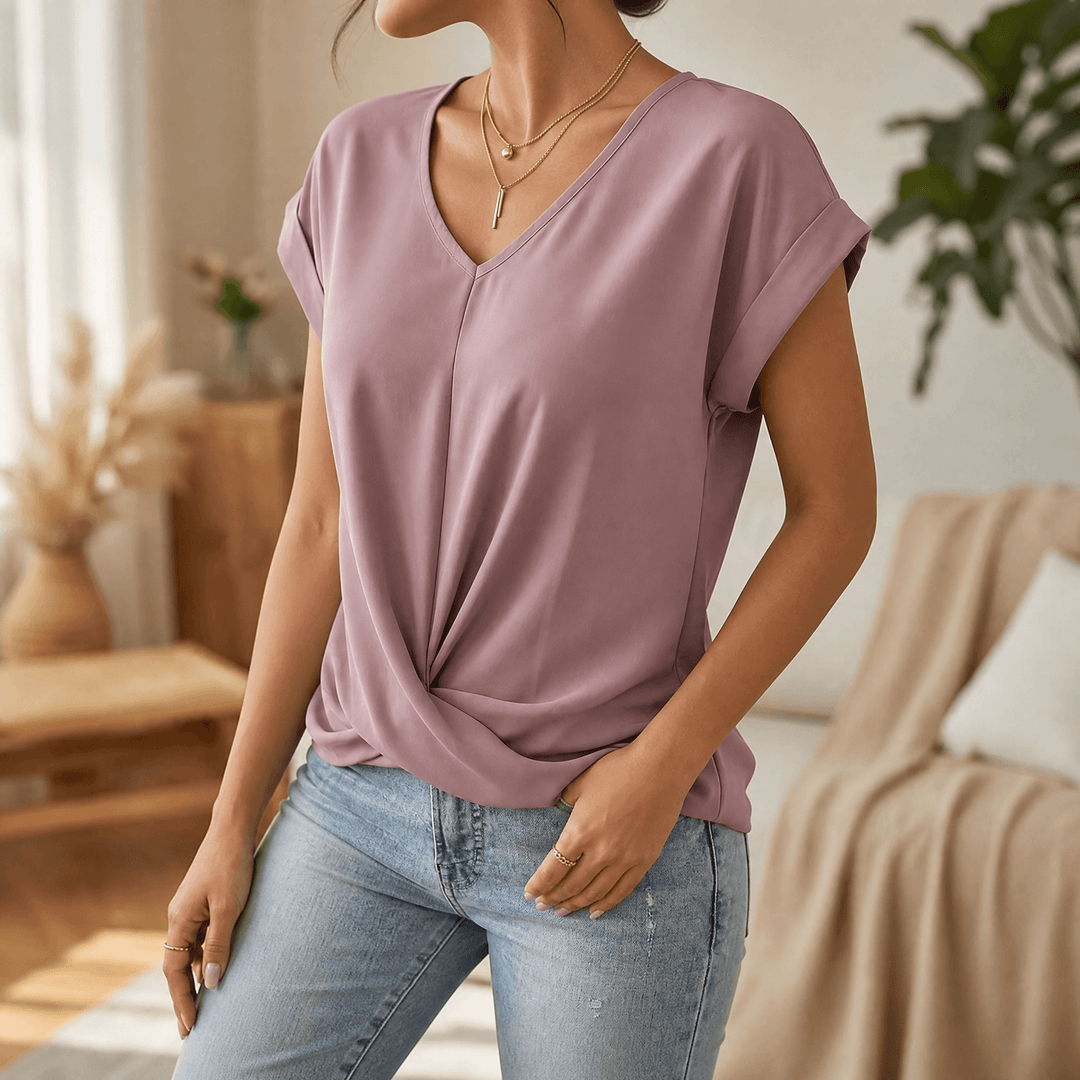 Women's stylish everyday top: V-neck, cap sleeves, and a unique twist front detail. Comfortable.