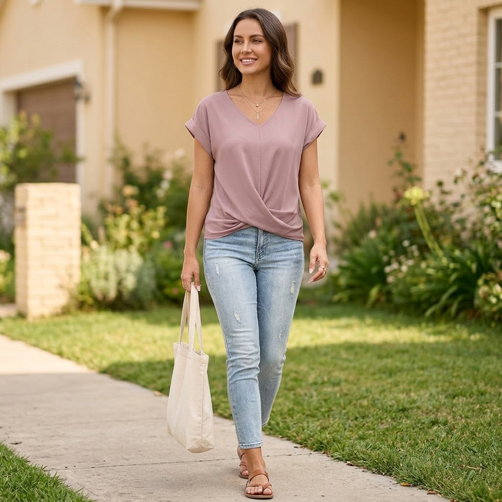 Chic women's cap sleeve top, v-neck with unique twist front design. Comfortable & stylish.