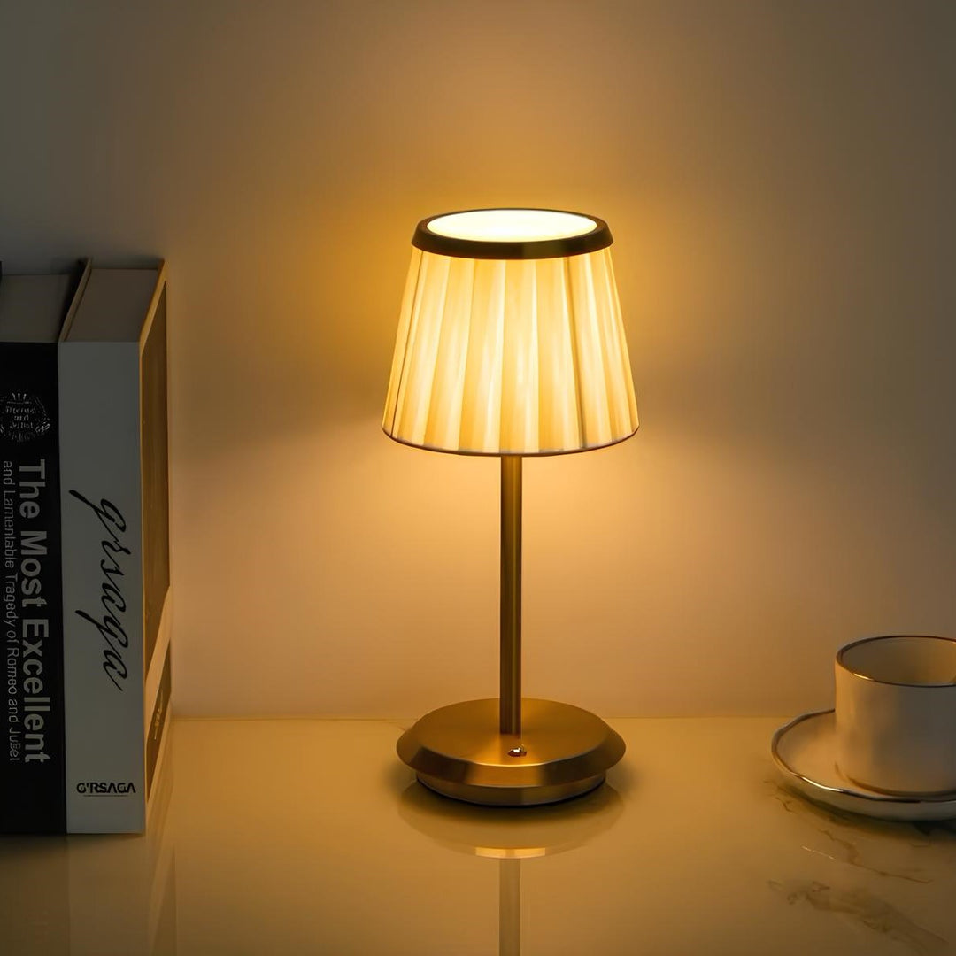 Waterproof modern rechargeable table lamp with fabric shade & gold accents. Cordless LED perfect for stylish decor.
