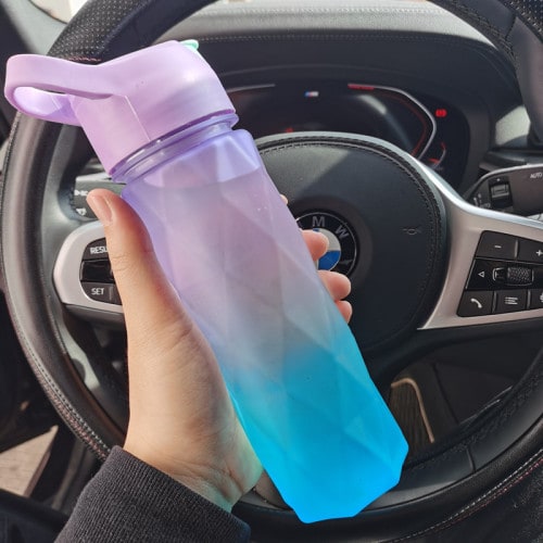 Stylish girls' misting water bottle for sports and gym, featuring a spray function.
