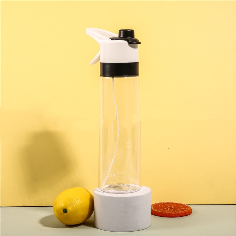 Girls' athletic misting water bottle with spray trigger, ensuring constant hydration.