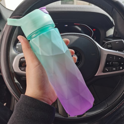 Innovative girls' misting water bottle, combining hydration & cooling spray for sports.