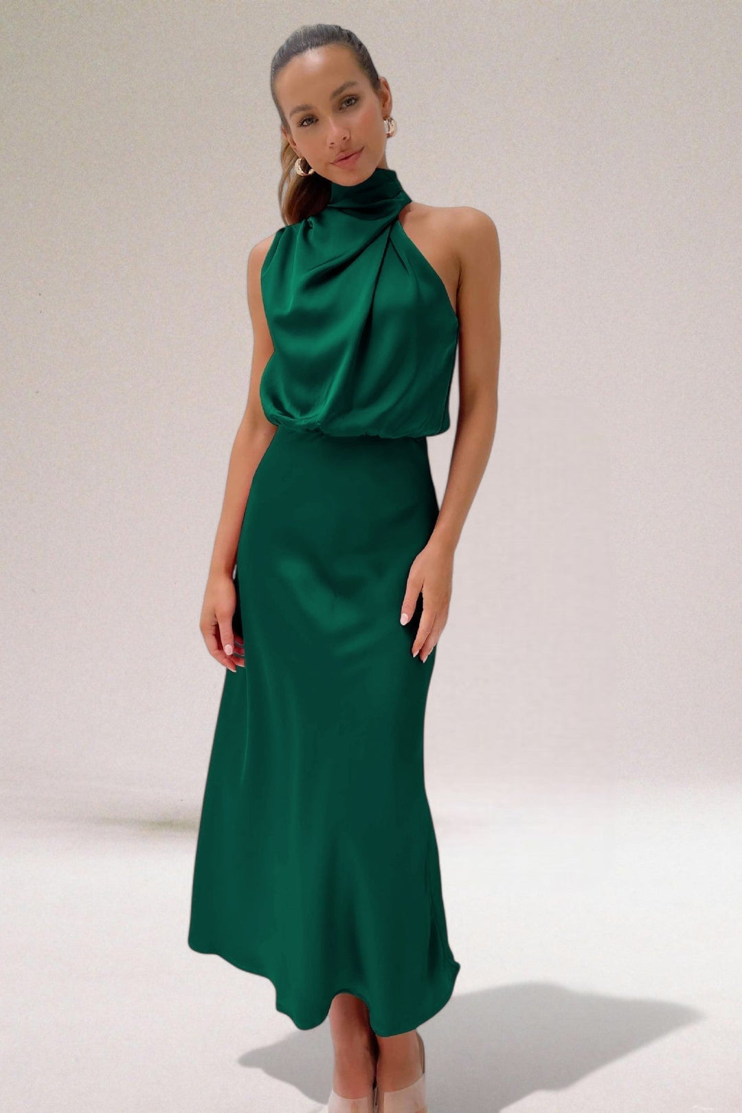 Chic women's halter neck maxi dress, an elegant choice for sophisticated special occasions & formal parties.
