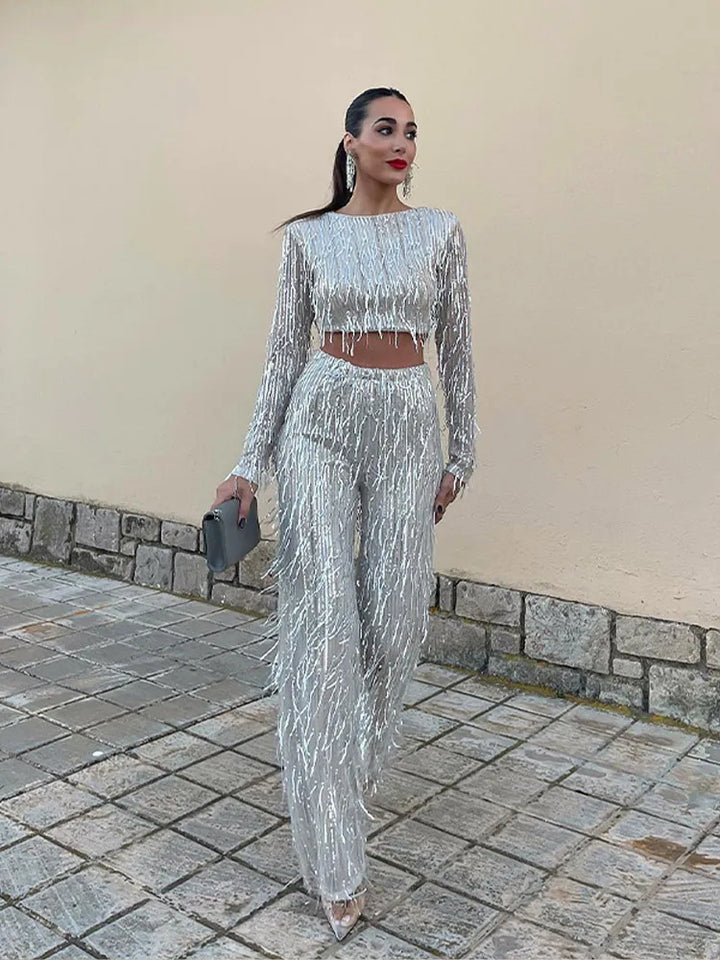 Woman models a sparkling sequin two-piece set; ideal glamorous party or special occasion wear.