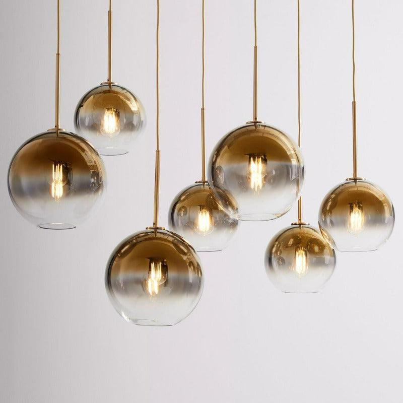 Decorative glass ball pendant light in a black finish, offering modern lighting solutions.