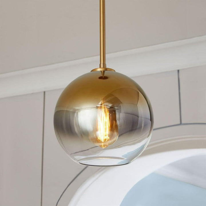 Elegant modern glass pendant light, perfect as a decorative ceiling fixture for any room.