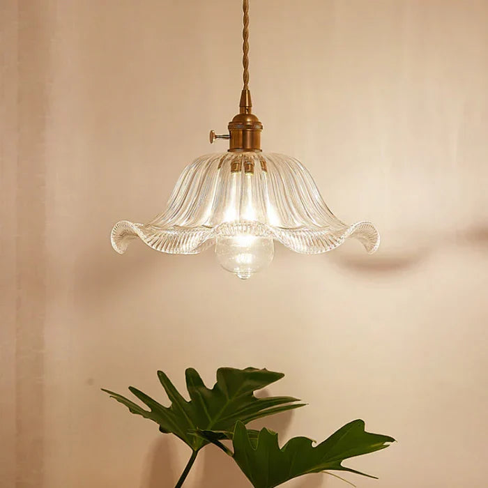 Kitchen island glass pendant light, sleek industrial style ceiling fixture.