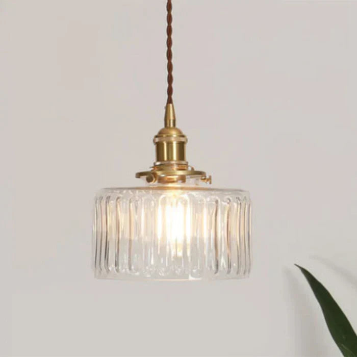 Sleek glass pendant lamp, perfect for contemporary dining room lighting.
