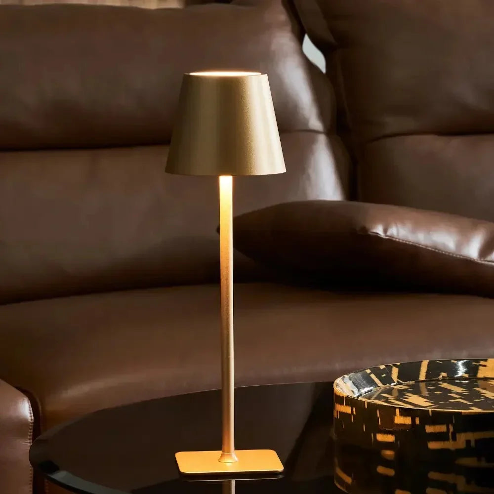 Indoor/outdoor dimmable LED table lamp, modern aesthetic. Rechargeable for portable lighting.