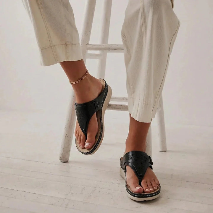 Stylish black women's walking sandals, ergonomic design for arch support & foot comfort.