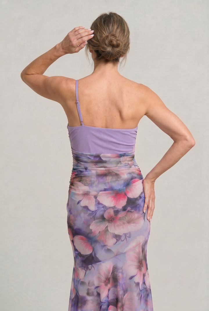 Purple floral asymmetric one-shoulder evening dress. Features a stylish high-low hem and a flattering ruched waist.