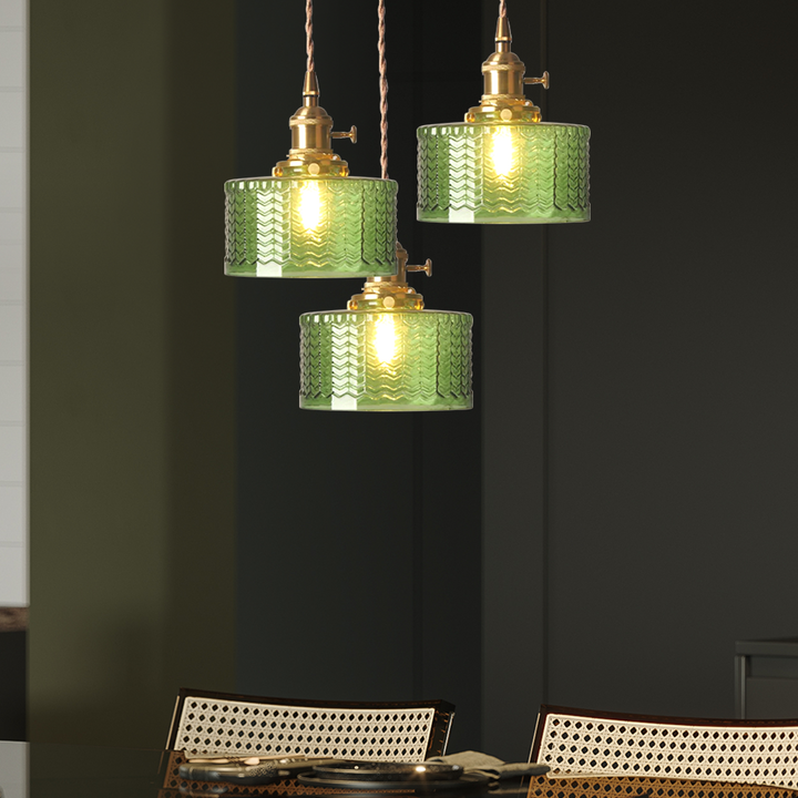 Elegant adjustable glass pendant light, green or clear, for stylish homes.