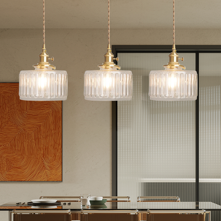 Clear glass hanging lamp, versatile for kitchen, dining, or hallway.