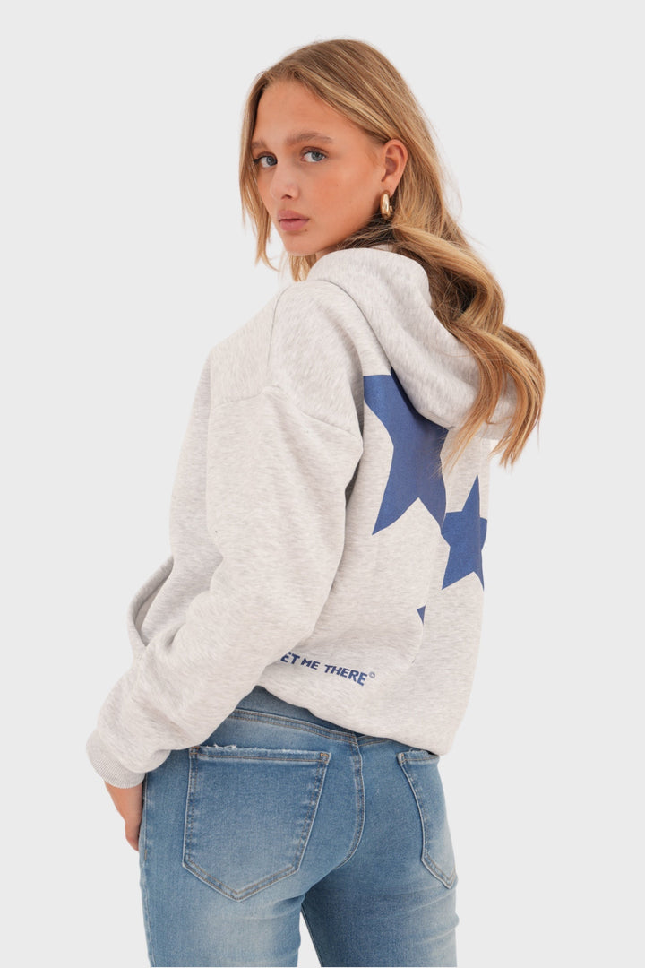 Women's grey pullover sweater with playful white star print. Cozy & stylish long-sleeve knit, perfect for casual autumn wear.