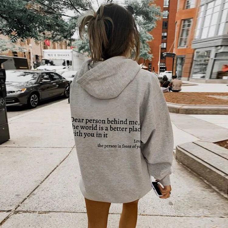 Casual women's pullover hoodie, soft fabric, "Be Kind" statement fashion top.