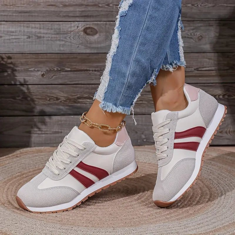 Red women's retro lace-up sneakers with classic color block design, perfect for casual everyday wear.