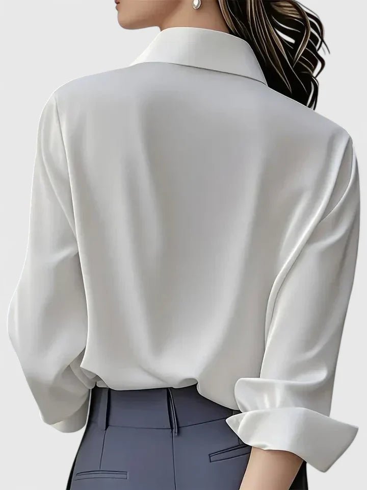 Modern women's long-sleeve work blouse, elegant concealed placket design enhances professional office fashion.