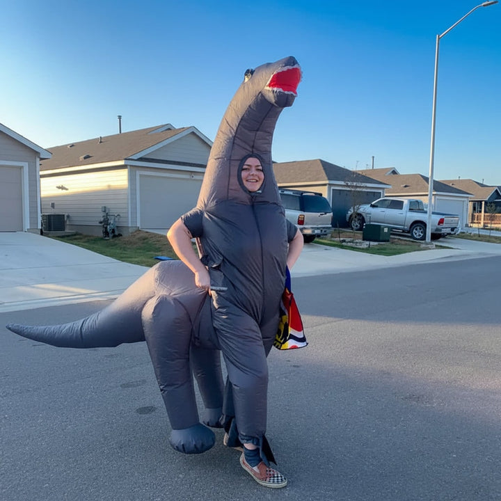 Full-body inflatable dinosaur costume for Halloween, costume parties, or unique cosplay. Fun adult & child sizes.