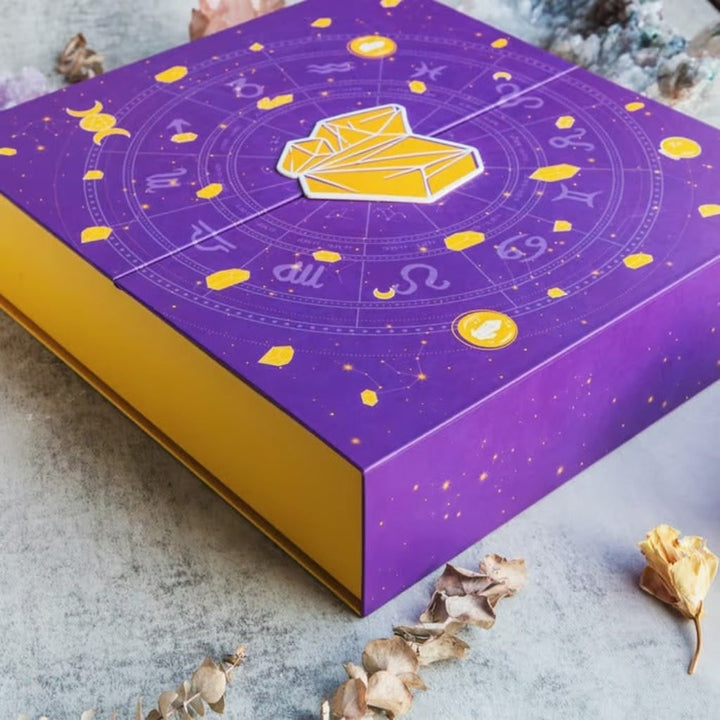 Assorted gemstones revealed daily in a Halloween crystal advent calendar, enhancing spiritual decor & mystery gifts.