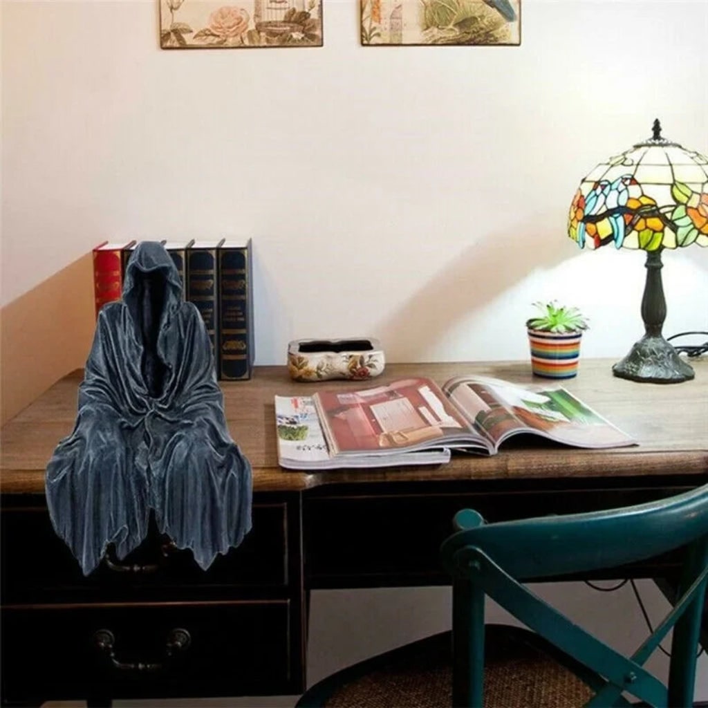 Eerie Grim Reaper sculpture, a fearsome addition to any Halloween setup or gothic themed room.