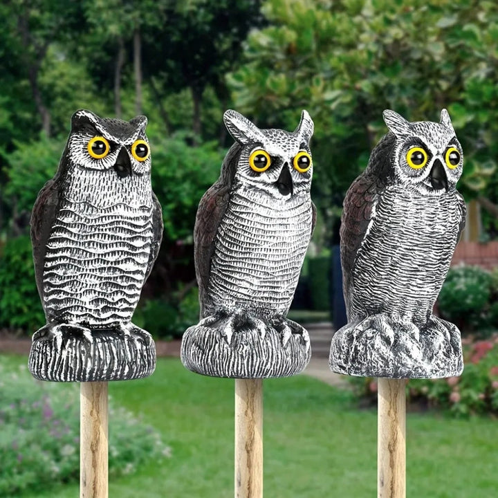 Lifelike plastic owl garden statue, ideal for yard pest control or spooky Halloween decoration.