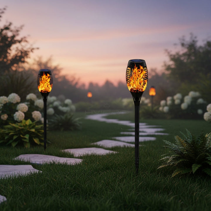 Spooky flickering flame solar outdoor light, ideal Halloween garden decor for festive seasonal parties & pathways.