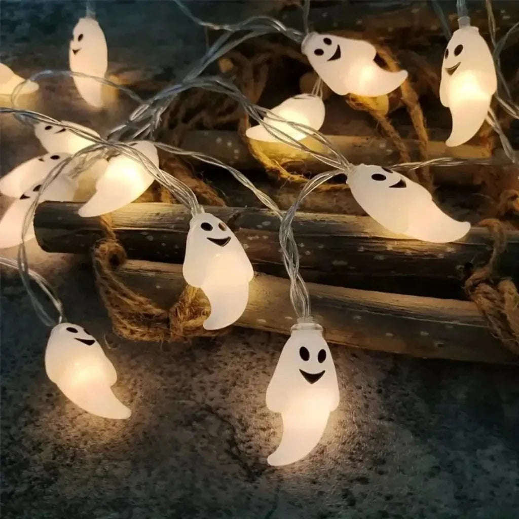 Set of glowing ghost LED string lights for Halloween decorations, suitable for indoor and outdoor party settings.