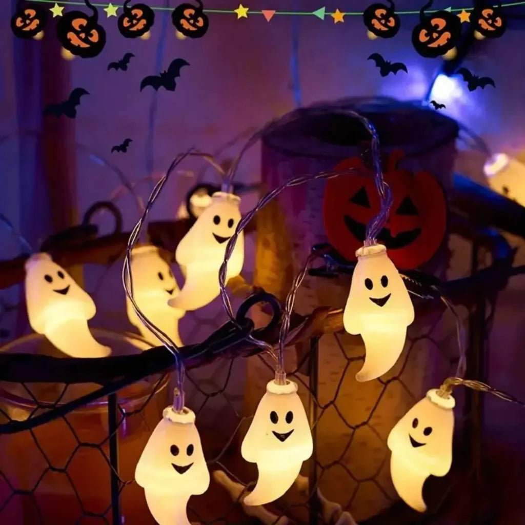 Whimsical white ghost LED string lights illuminating a dark room, perfect for Halloween party or home decor.