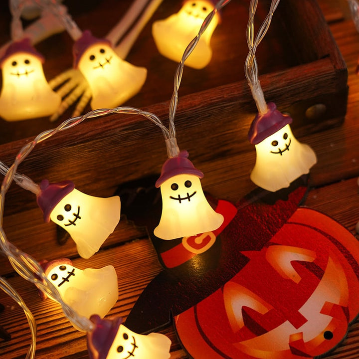LED string lights for Halloween tombstone decor, battery-operated & spooky for yard displays.