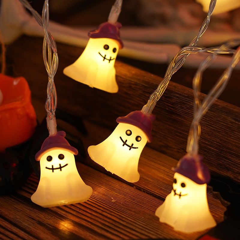 Spooky LED pumpkin string lights, battery operated for indoor & outdoor Halloween party decor.