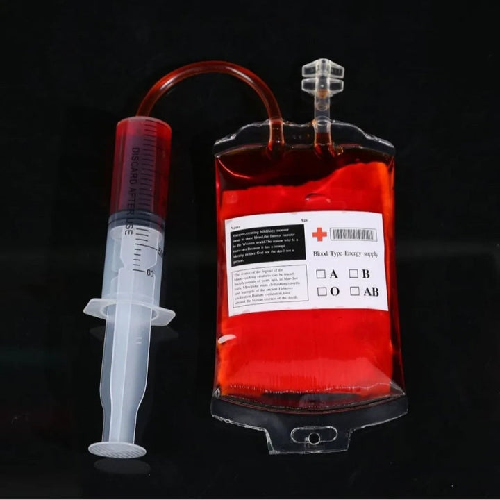 Reusable blood bag novelty drinkware with syringe & IV tubing, ideal for spooky costume parties.