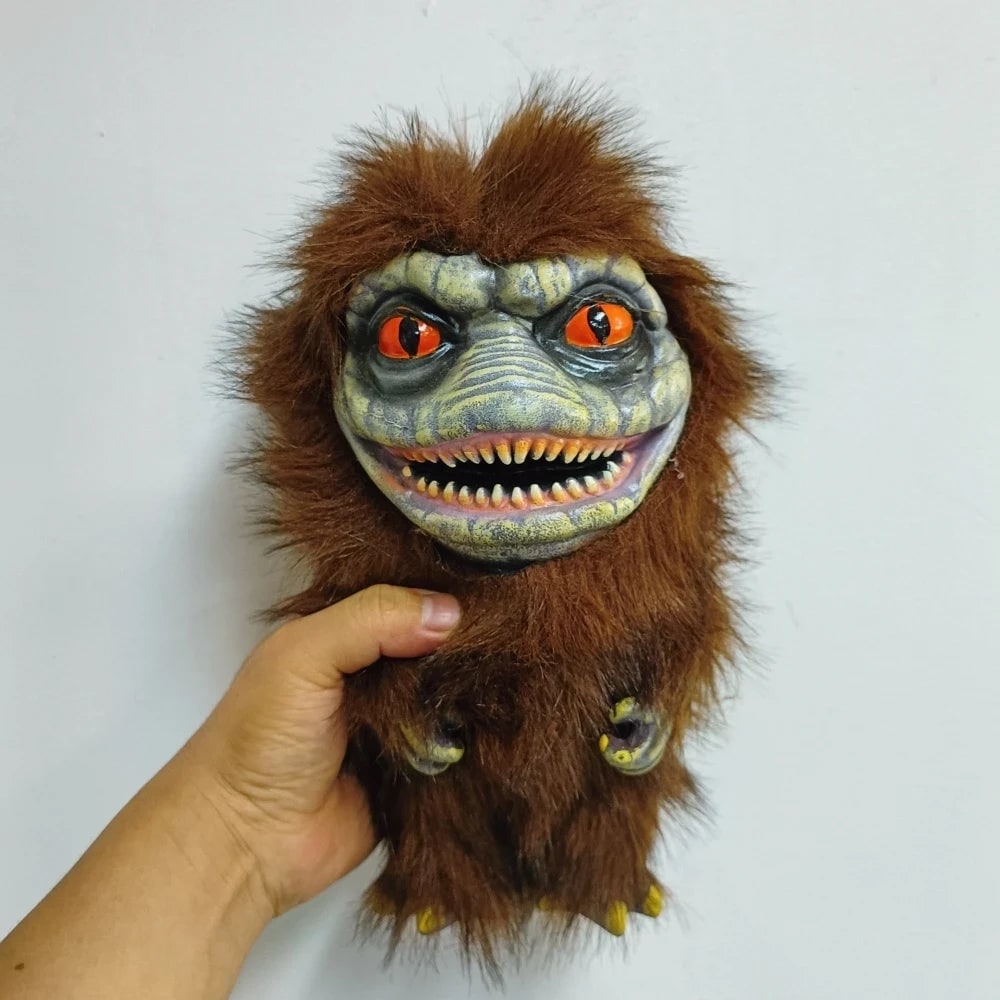 Soft textured orange creepy monster plush toy, a fun collectible stuffed animal for Halloween.
