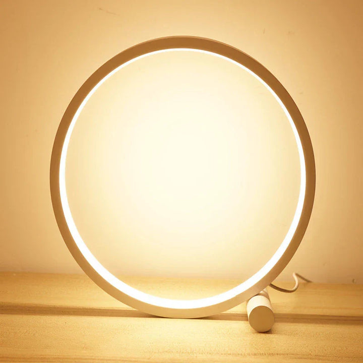 Sleek aluminum halo ring LED nightstand lamp, dimmable for custom lighting, modern decor aesthetic.