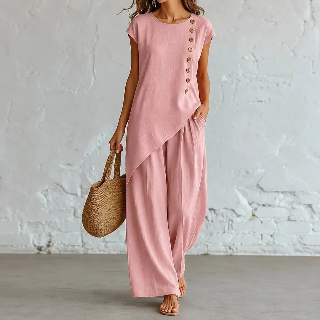 Effortless women's co-ord set in a neutral tone, featuring relaxed wide-leg pants & asymmetric top.