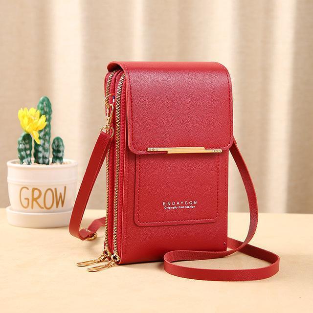 Women's versatile crossbody handbag with integrated touch screen phone pocket and card organizer.
