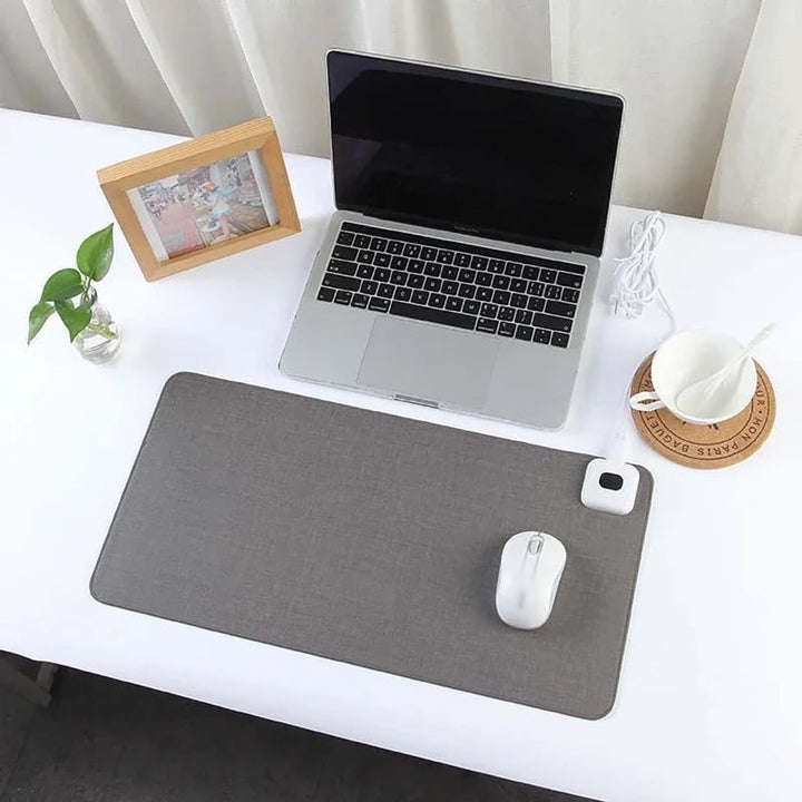Unisex heated desk pad with temperature control, boosting comfort & productivity for home office or gaming.