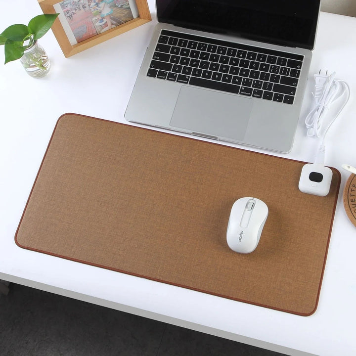 Felt surface heated desk pad, an ergonomic office accessory providing cozy warmth & comfort to your workspace.