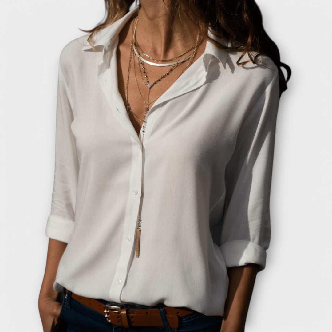 Women's polished collared button-down blouse, an elegant long-sleeve top ideal for professional workwear.