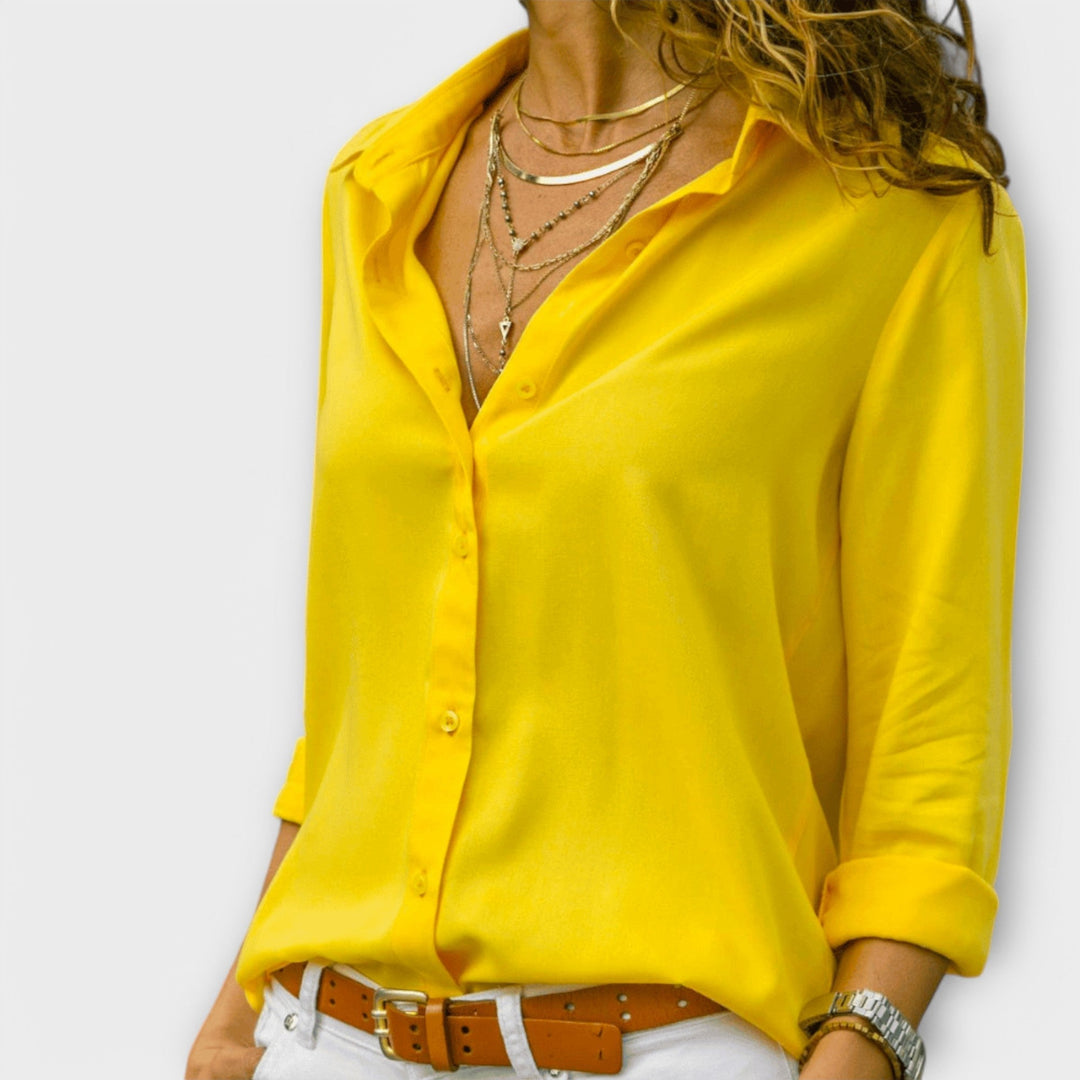 Chic women's long-sleeve collared button-down blouse, a polished workwear essential for modern fashion.