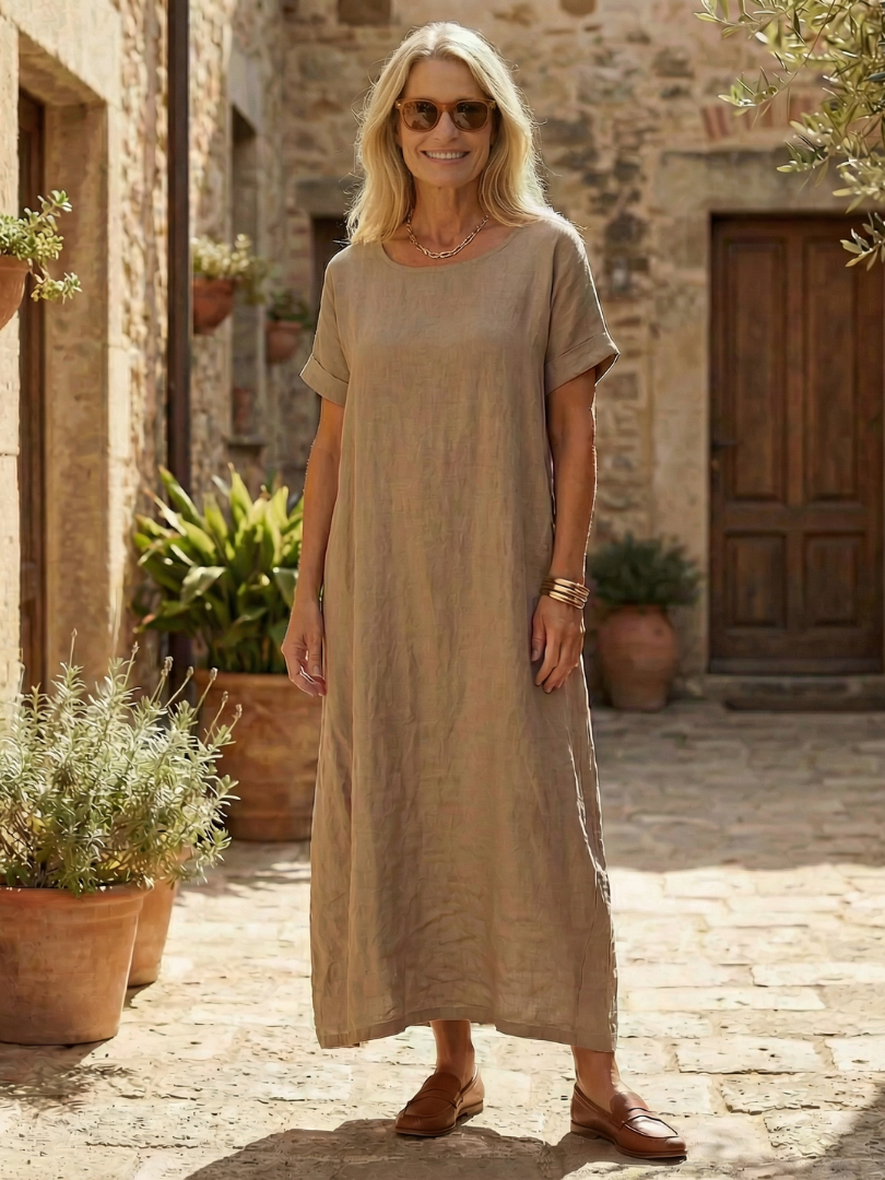Comfortable women's relaxed fit midi dress. Timeless, flowy casual wear with short sleeves & round neck for summer.