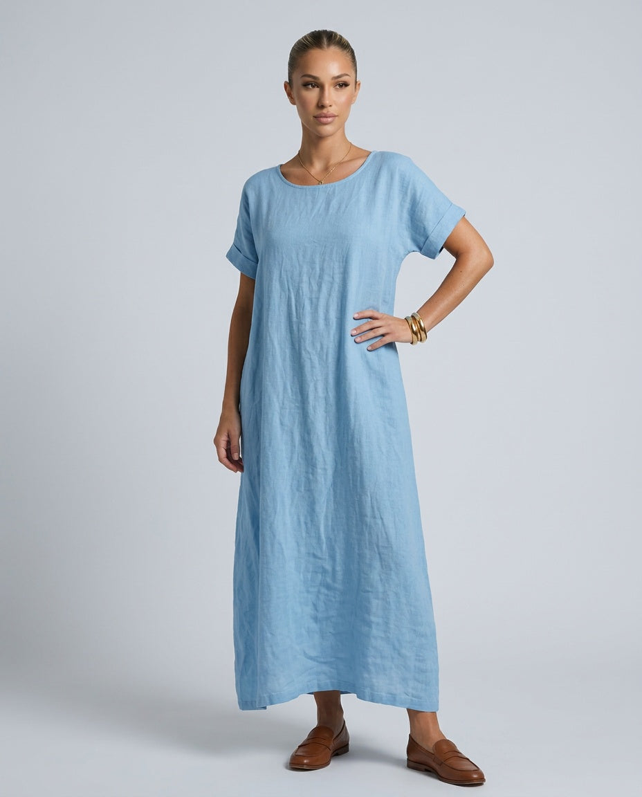 Close-up of round neck & short sleeve on women's relaxed fit midi dress. Timeless, comfortable casual summer fashion.