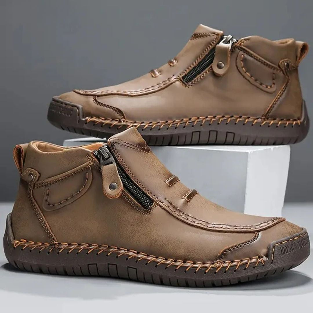 Supportive men's casual ankle boots with stylish stitched detail and practical side zipper.