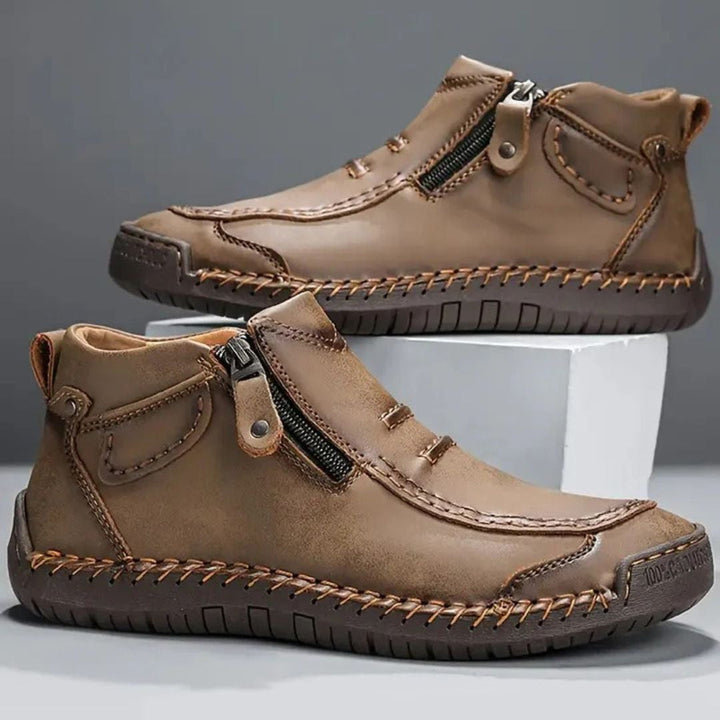 Supportive men's casual ankle boots with stylish stitched detail and practical side zipper.