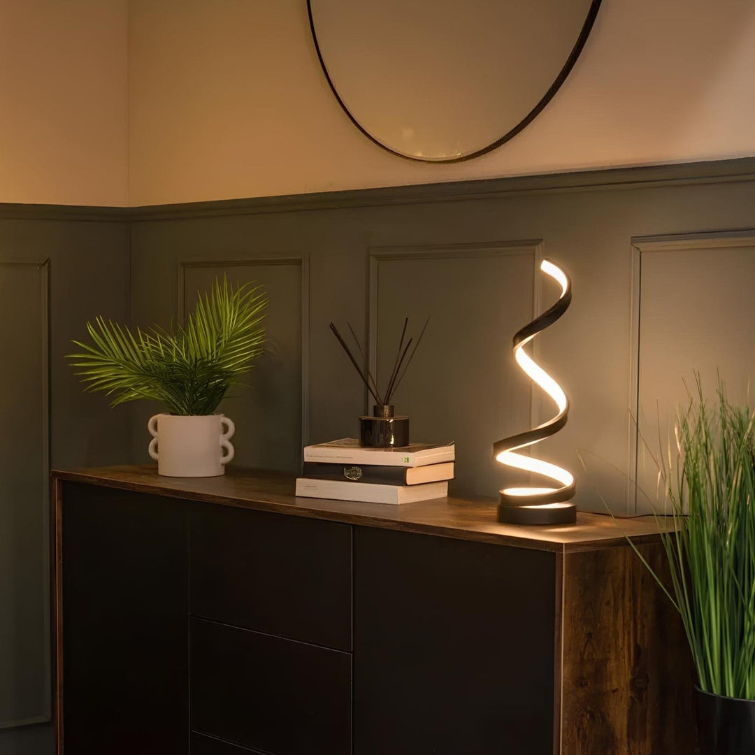 Modern spiral table lamp, an elegant LED accent light for contemporary living spaces & decor.