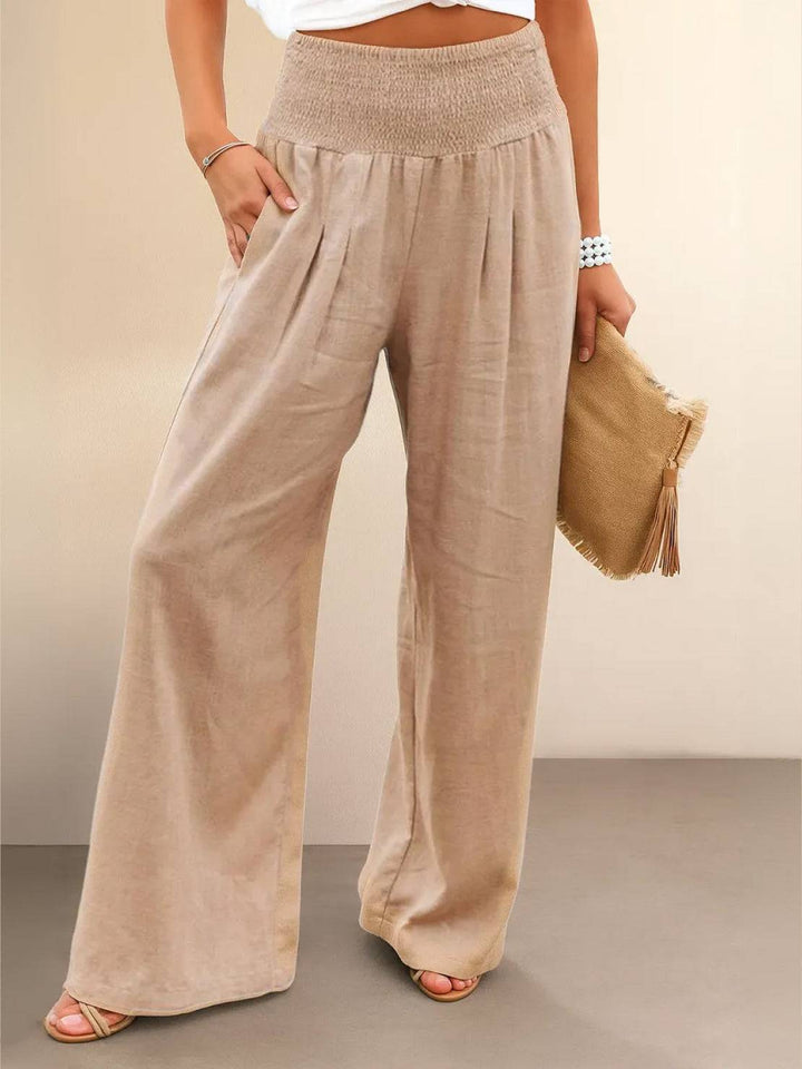 Women's high waist smocked wide leg palazzo pants for casual summer comfort.