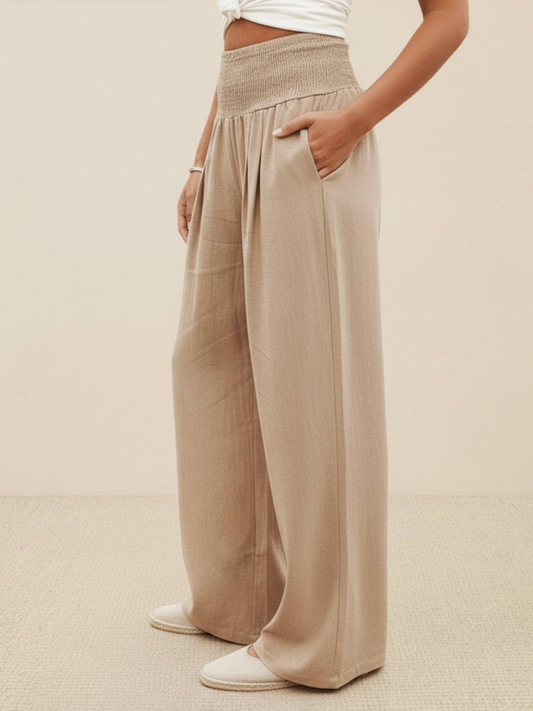 Navy blue high waist smocked wide leg palazzo pants, perfect for spring.